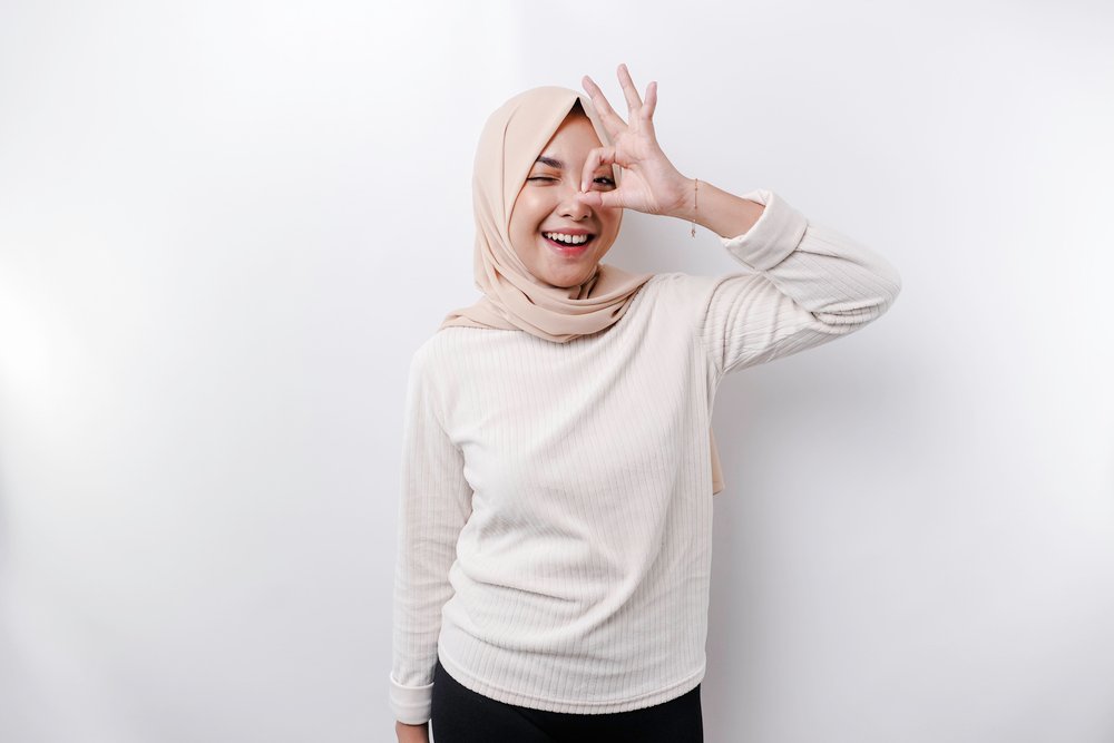 A Smiling Asian Muslim Woman Giving An Ok Hand Ges XYAYVQD
